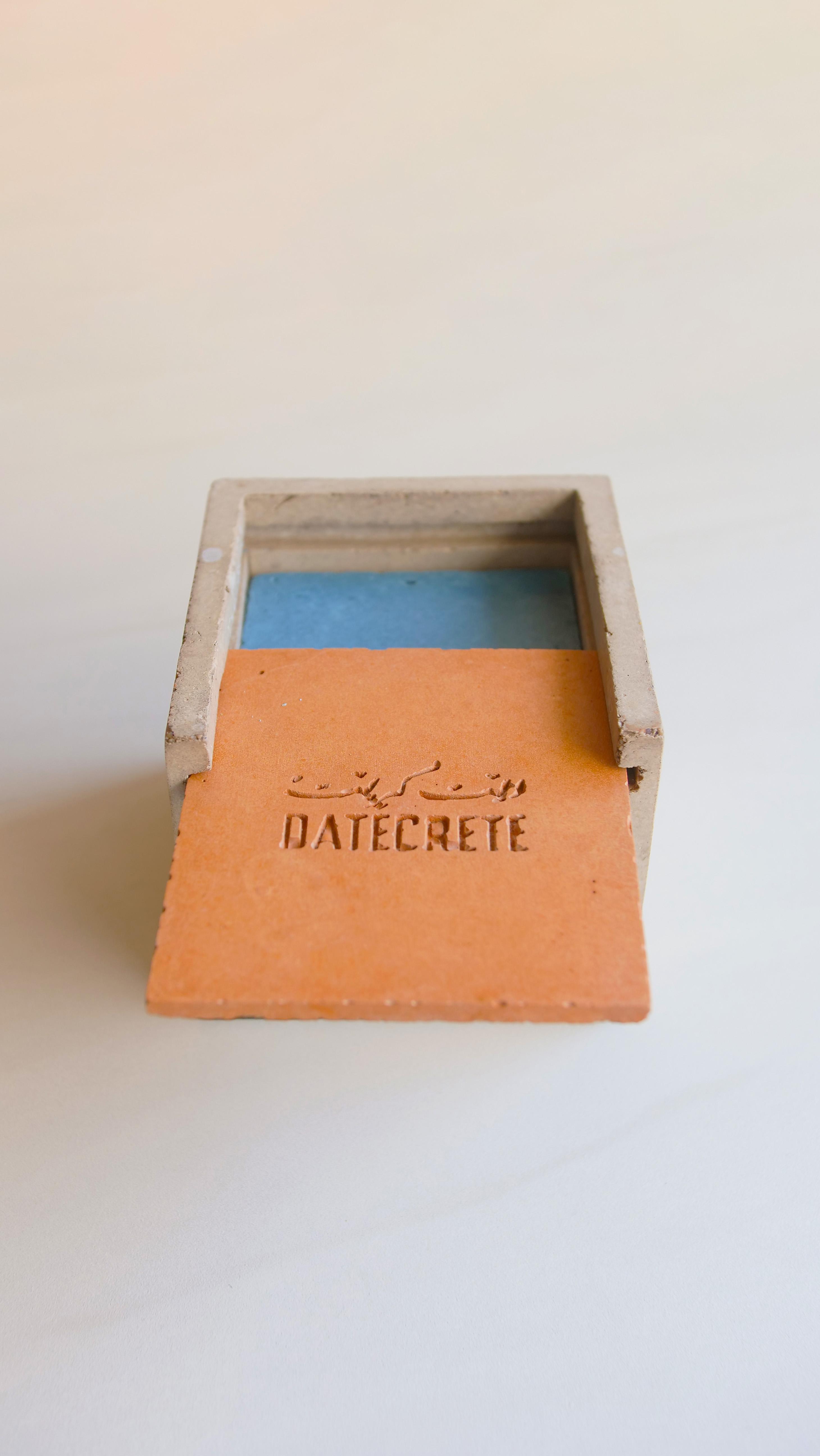 Top view of the Datecrete sample box with the lid slightly open.