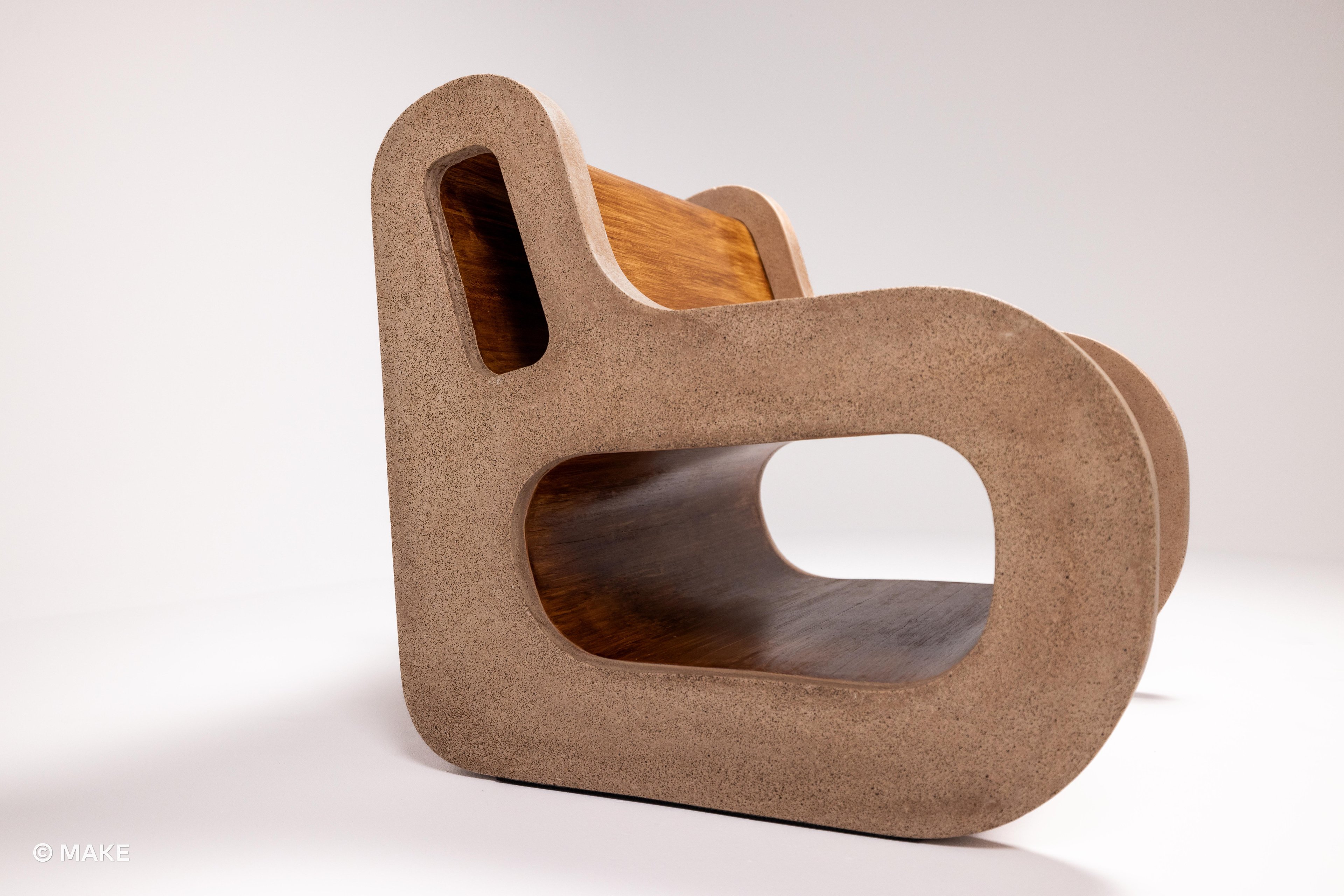 Side shot of the Datecrete Accent Chair focusing on the armrest.