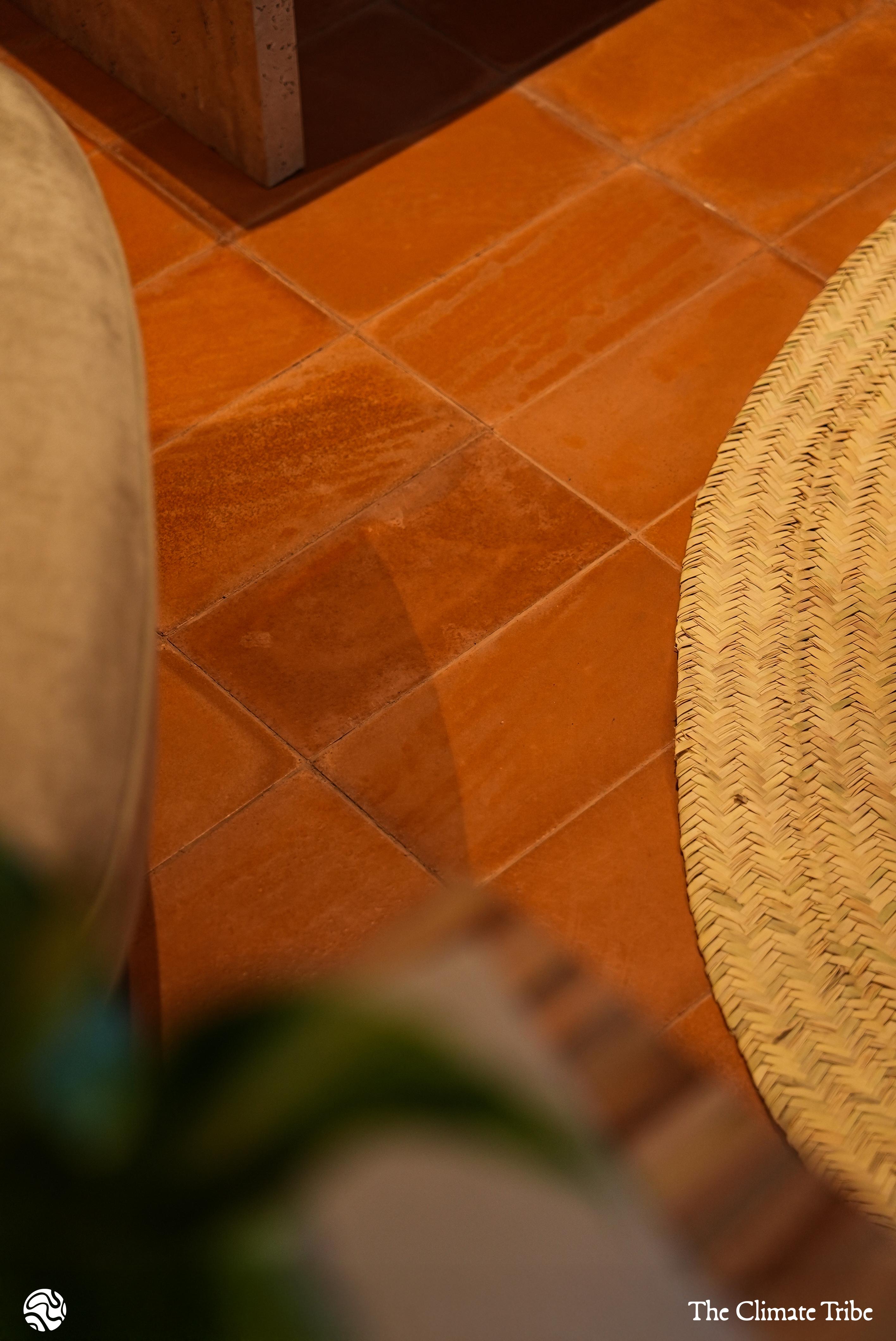 Shot of the Datecrete Sienna floor tiles beneath various pieces of furniture in-frame.