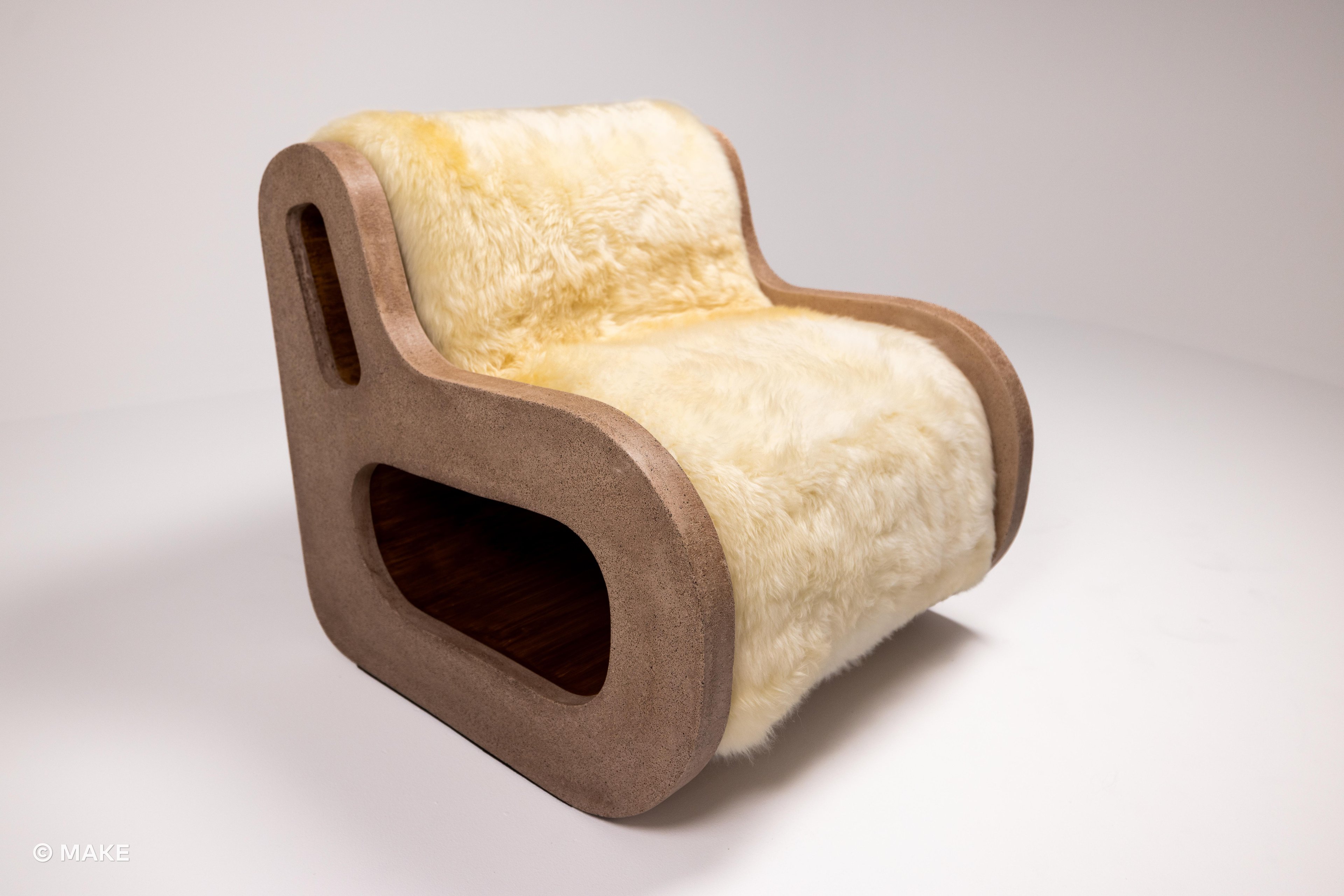 Full shot of the Datecrete Accent Chair with the sheepskin uholstery.