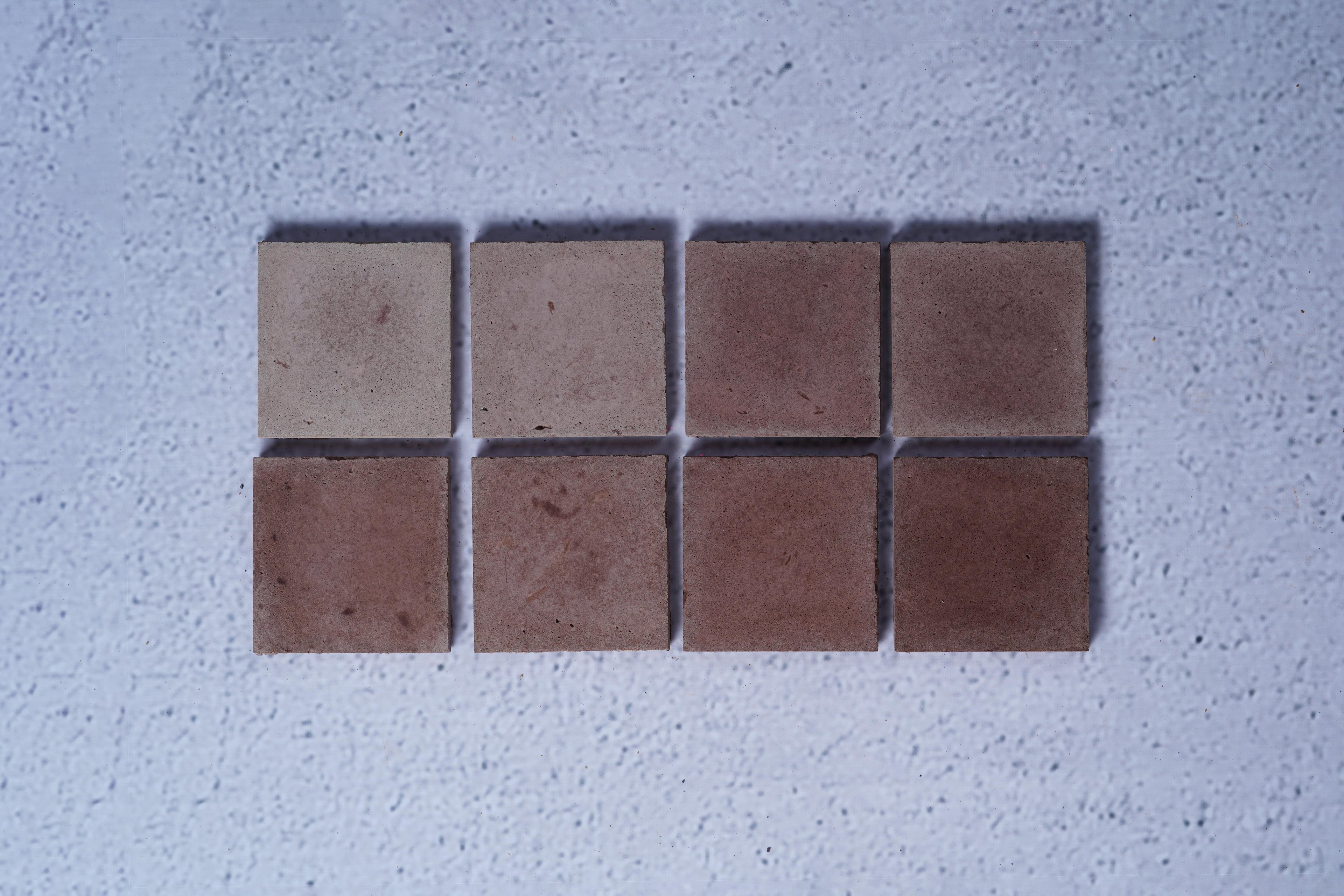 2 rows of 4 bricks in the style Chocolate, with the first row showing the raw finish and the second showing the enhanced.