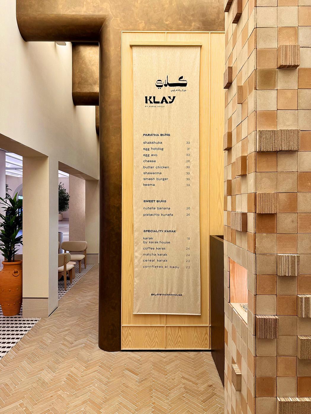 Corner of Klay's shopfront's wall of Datecrete tiles, pictured to the right of the Klay menu.
