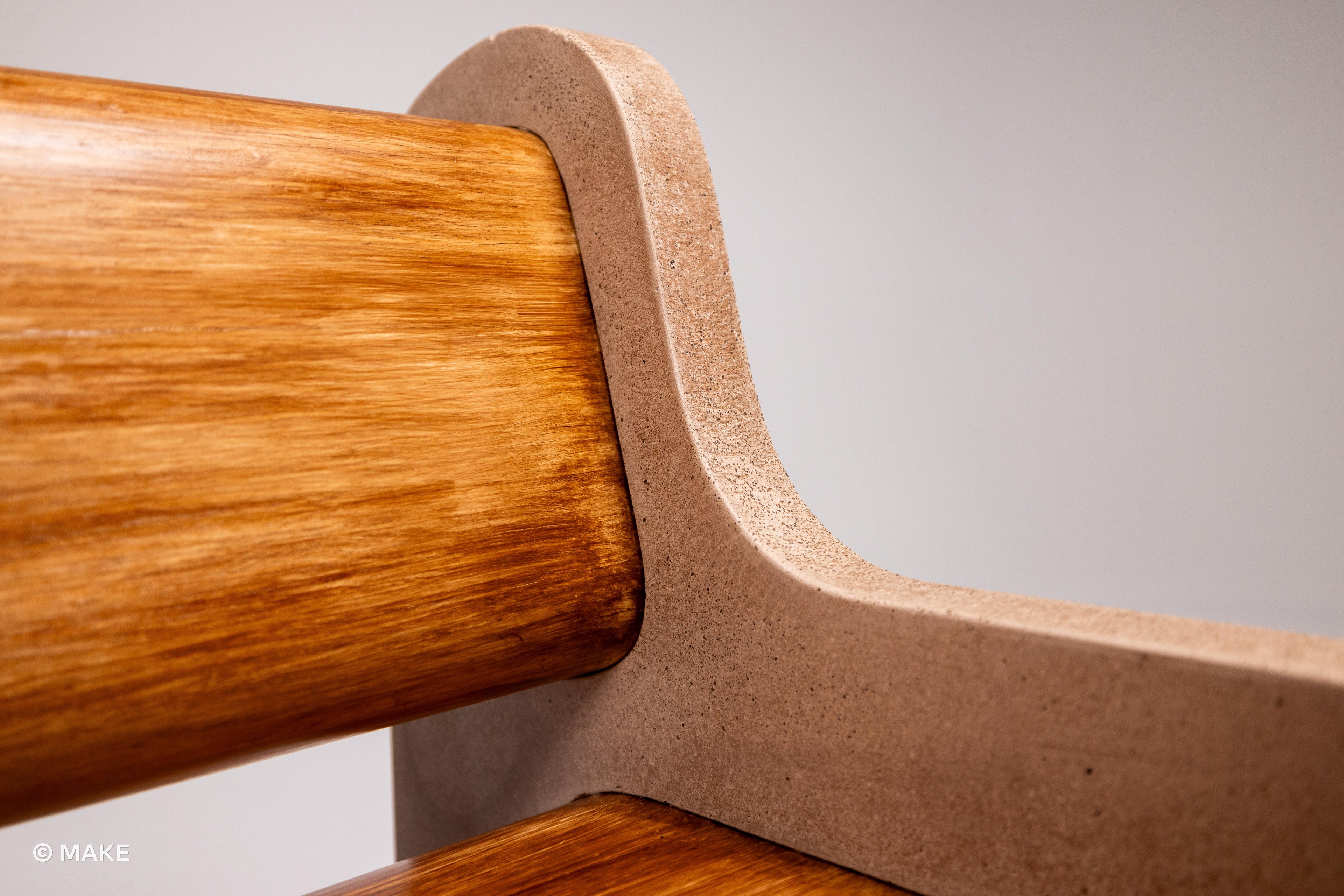 Close-up of the top-rail of the Datecrete Accent Chair.