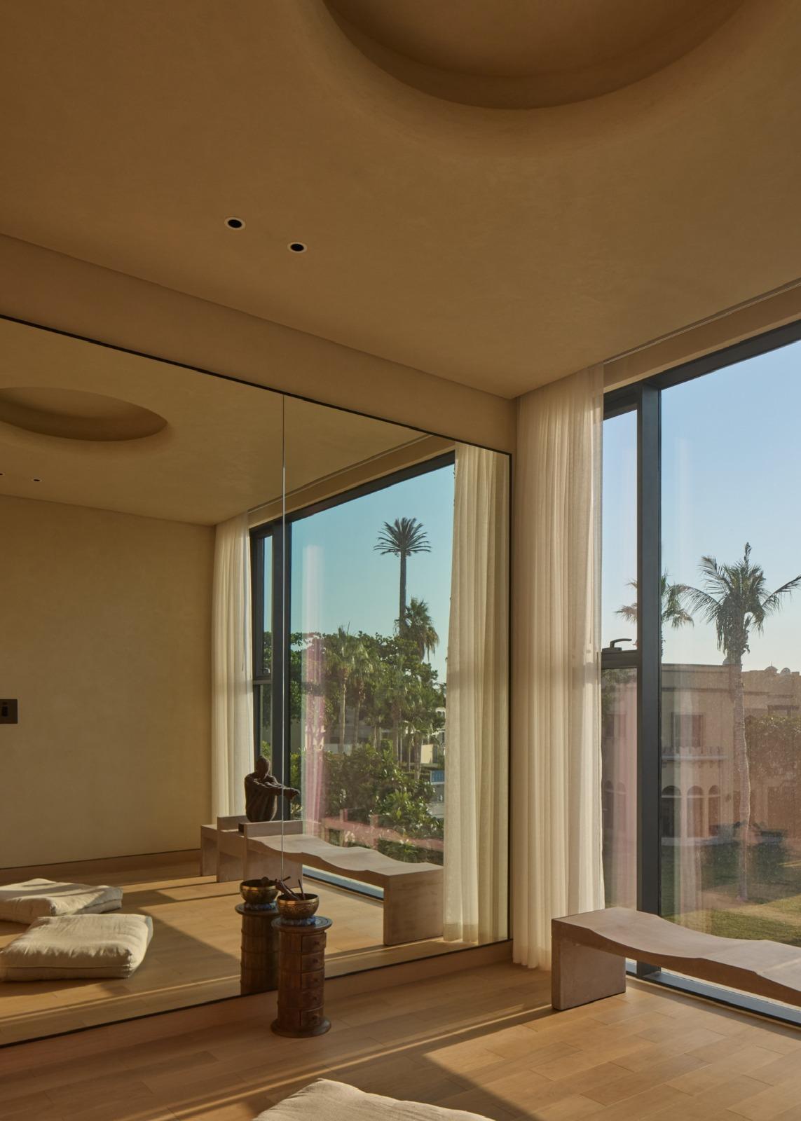 Shot of a room, with the Datecrete Bonsai Bench on the right edge of the shot, fully reflecting on the room's mirror.