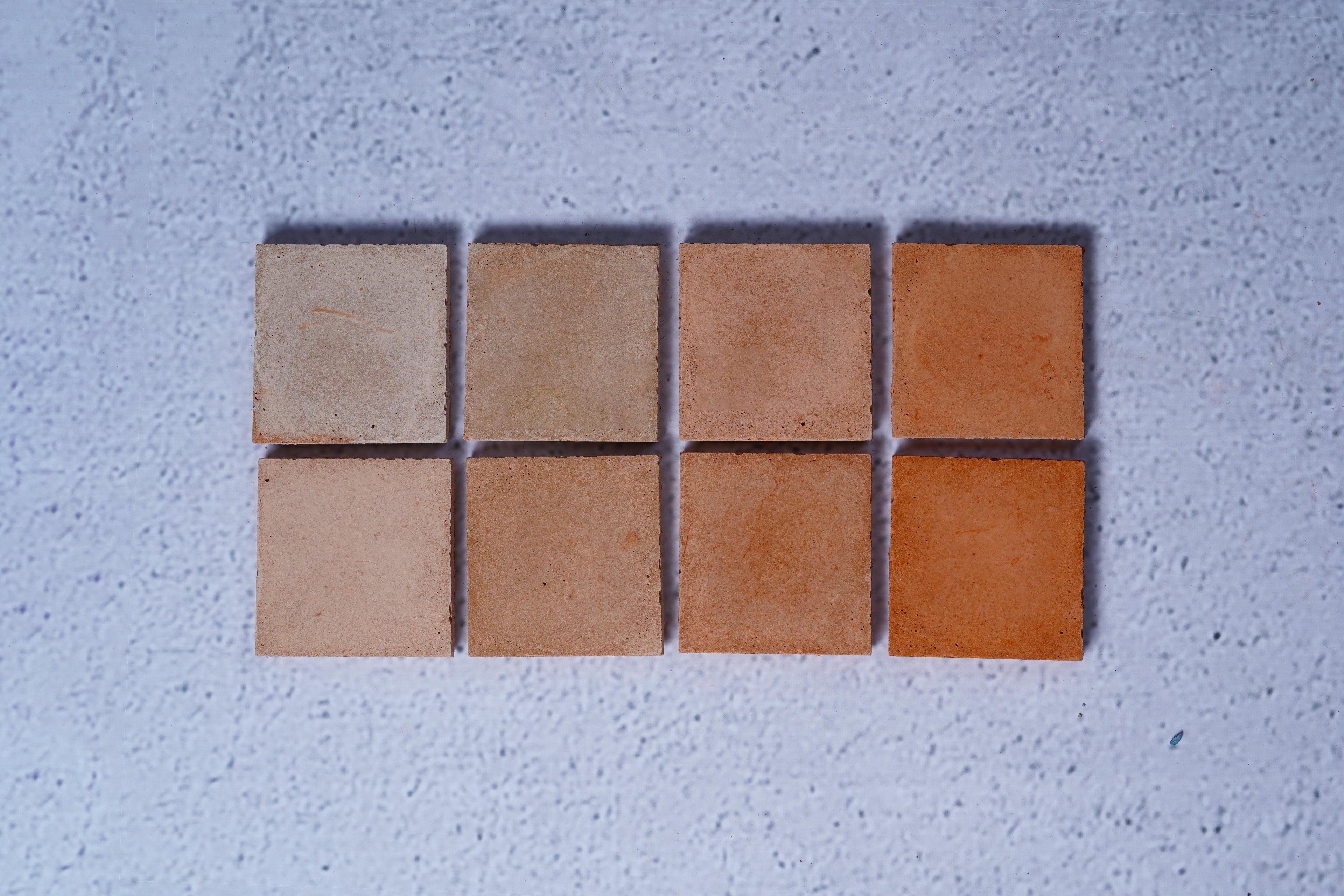 2 rows of 4 bricks in the style Sienna, with the first row showing the raw finish and the second showing the enhanced.