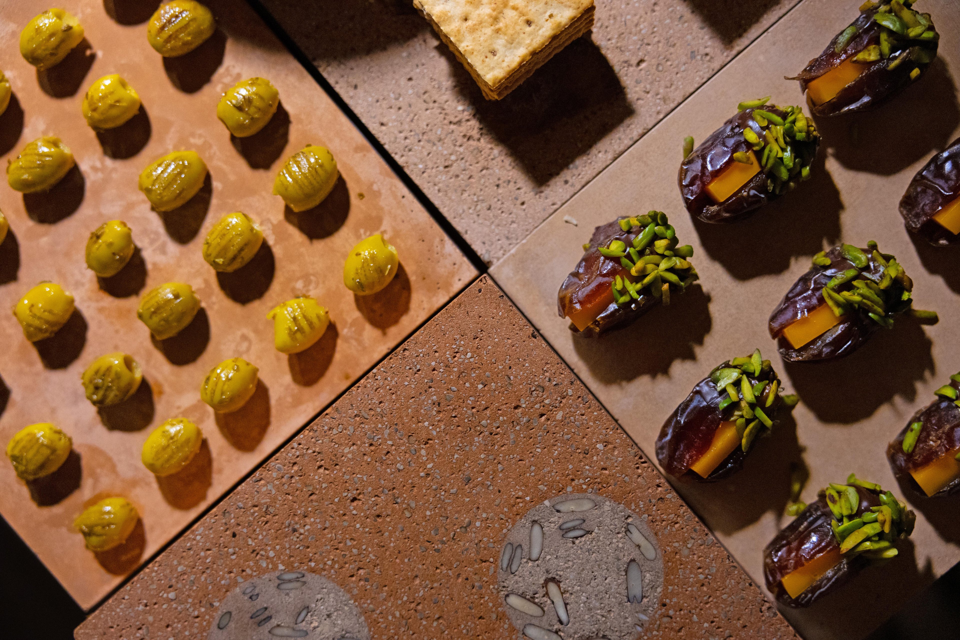 Canted overhead shot of the grazing scape, highlighting more different Datecrete styles and foodstuffs on top.